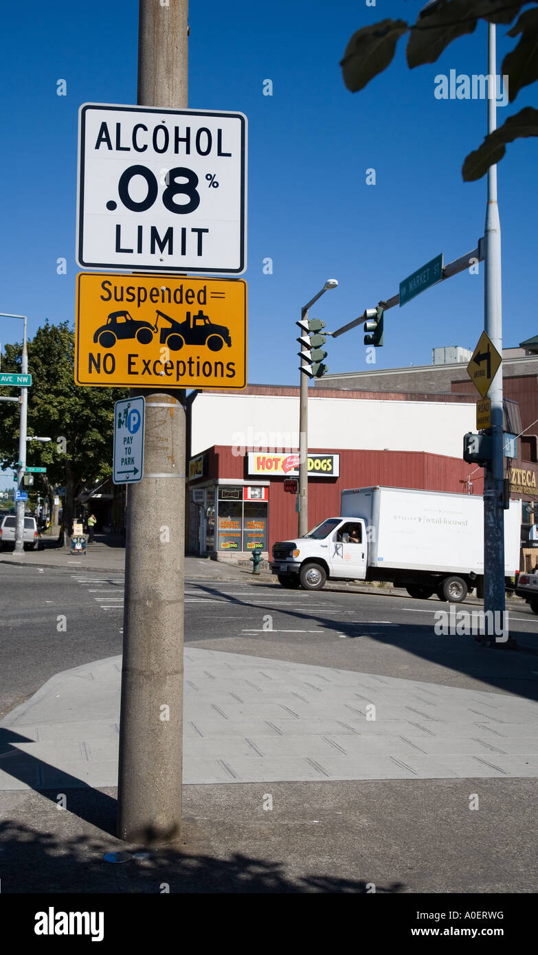 Alcohol limit and suspended towing no parking sign Seattle USA Stock Photo