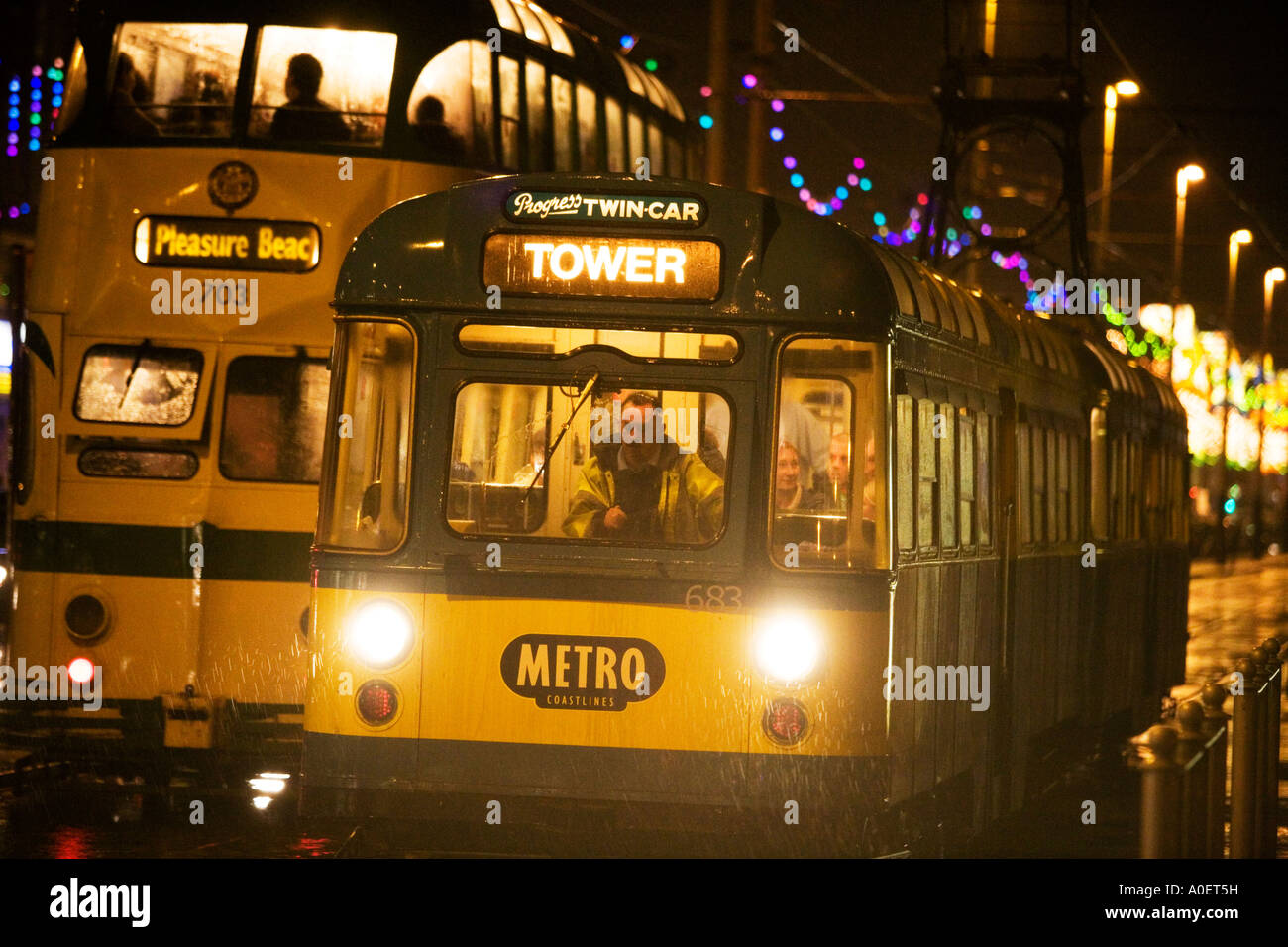 A traditional tram in rain at night at Blackpool seaside resort, UK. Stock Photo
