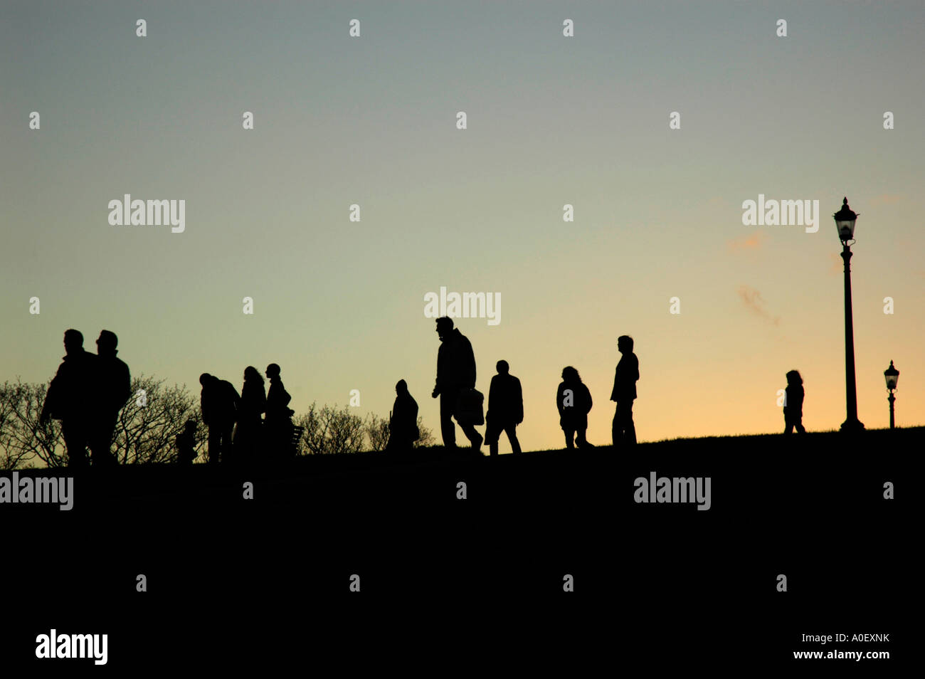 People enjoying the sunset on Primrose Hill, London, England, UK Stock Photo