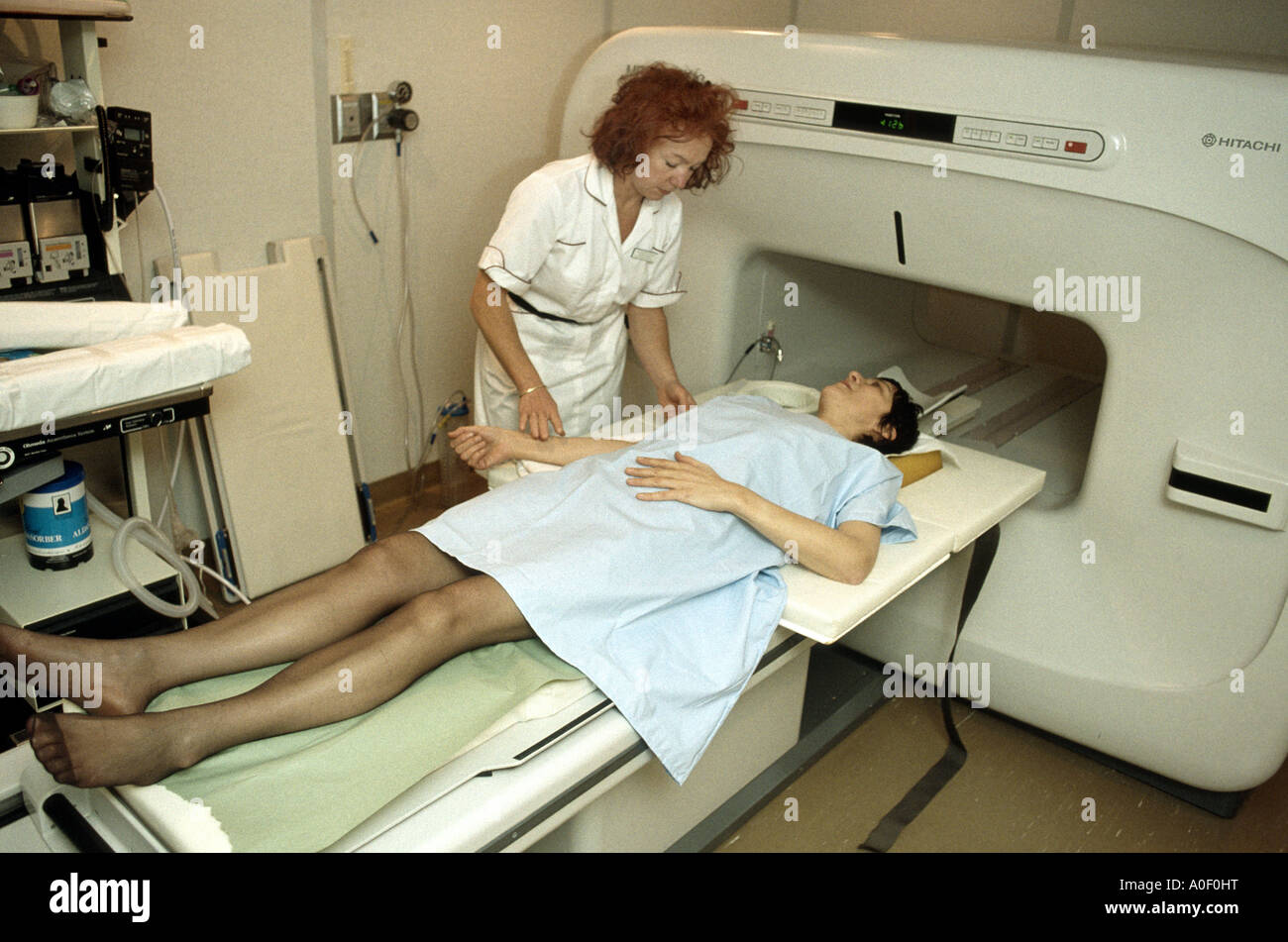 A nurse placing a patient on MRI scanner Stock Photo