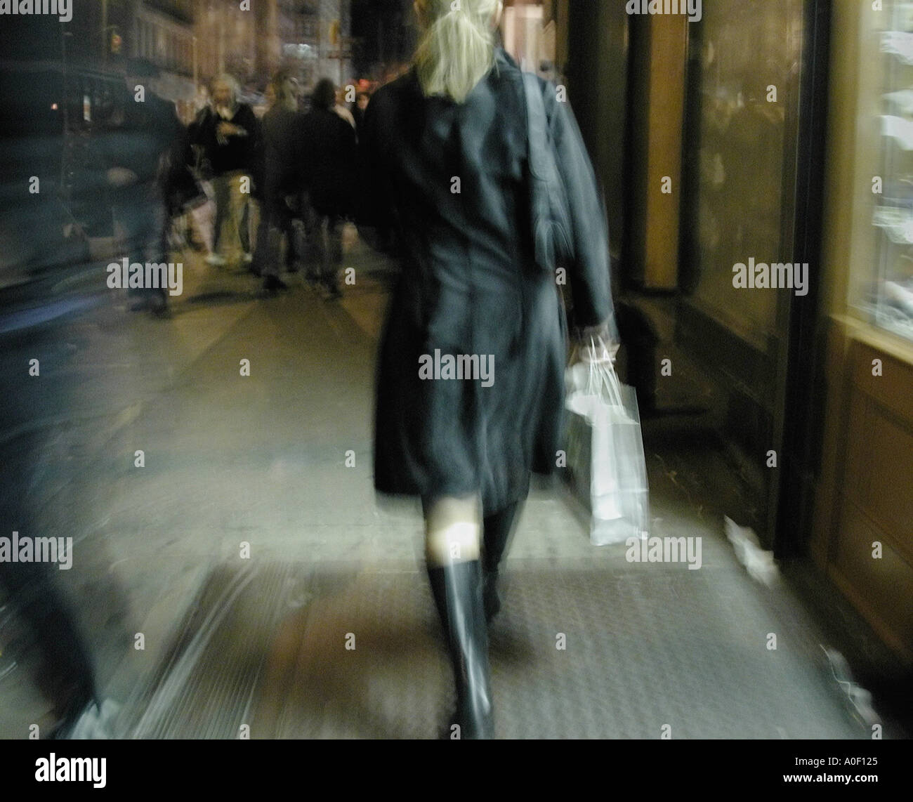 Woman coat walking rear view hi-res stock photography and images - Alamy