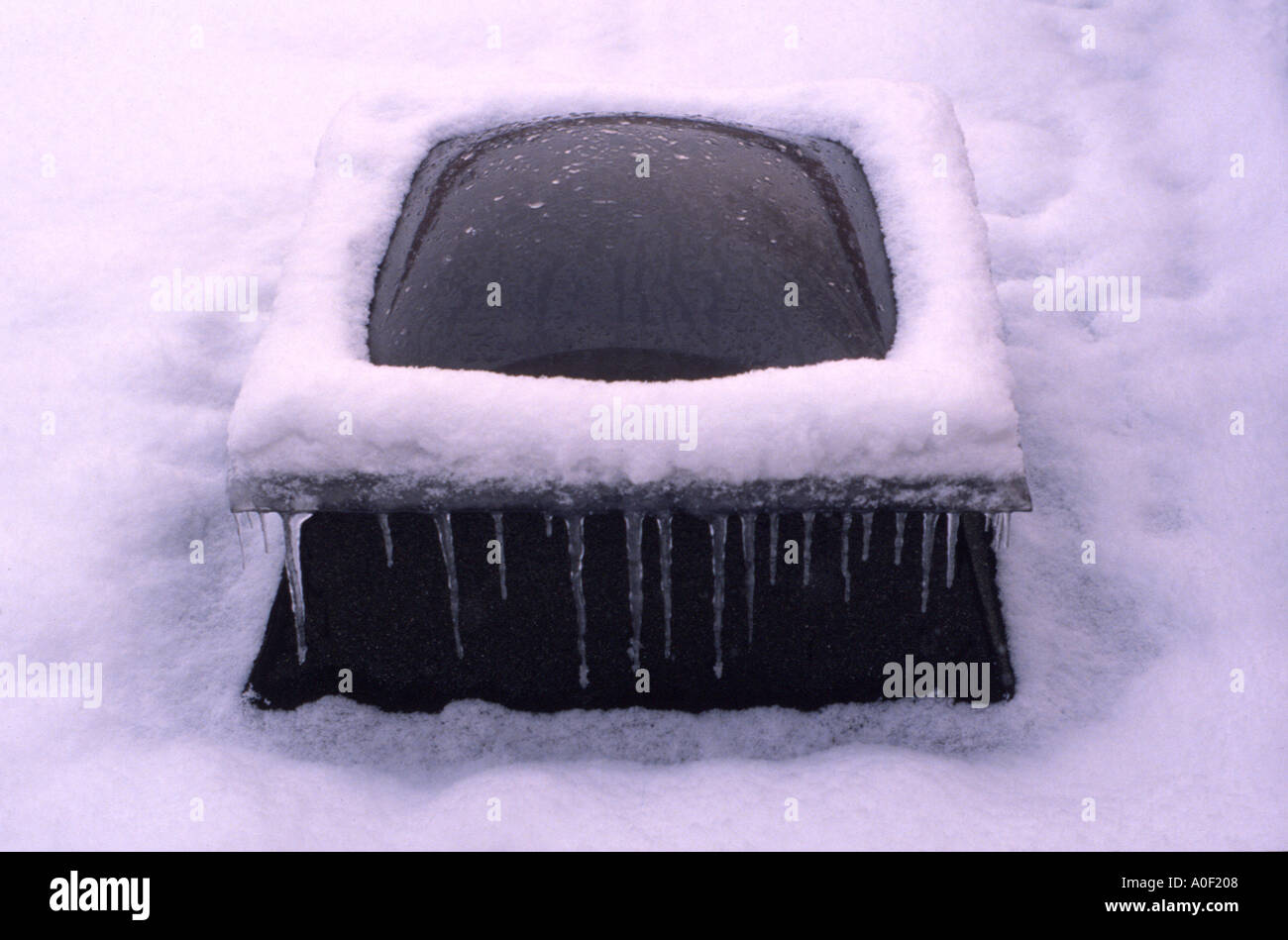 Skylight on a snow covered roof Heston Middlesex England UK Stock Photo