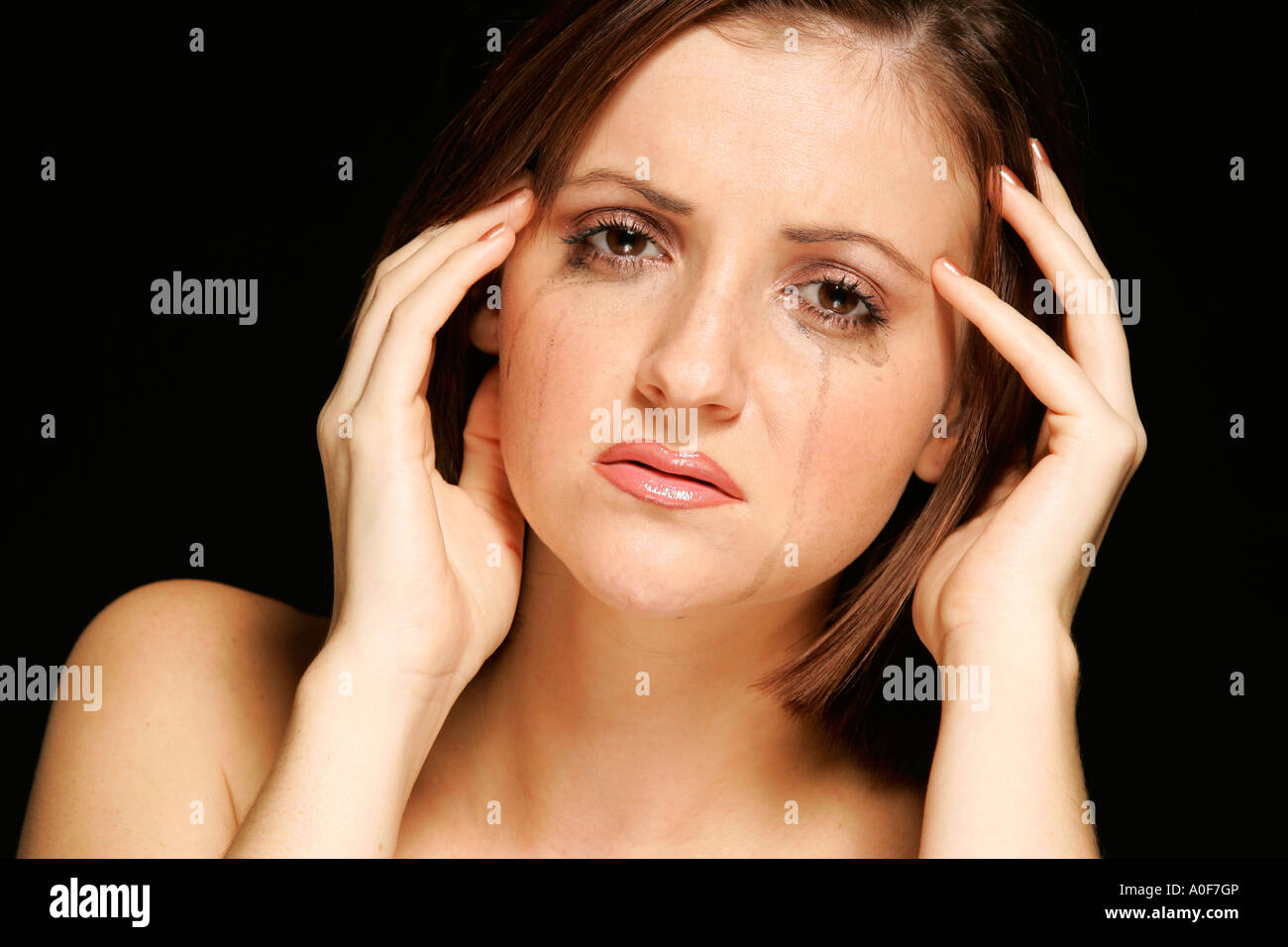 Young woman looking sad Stock Photo