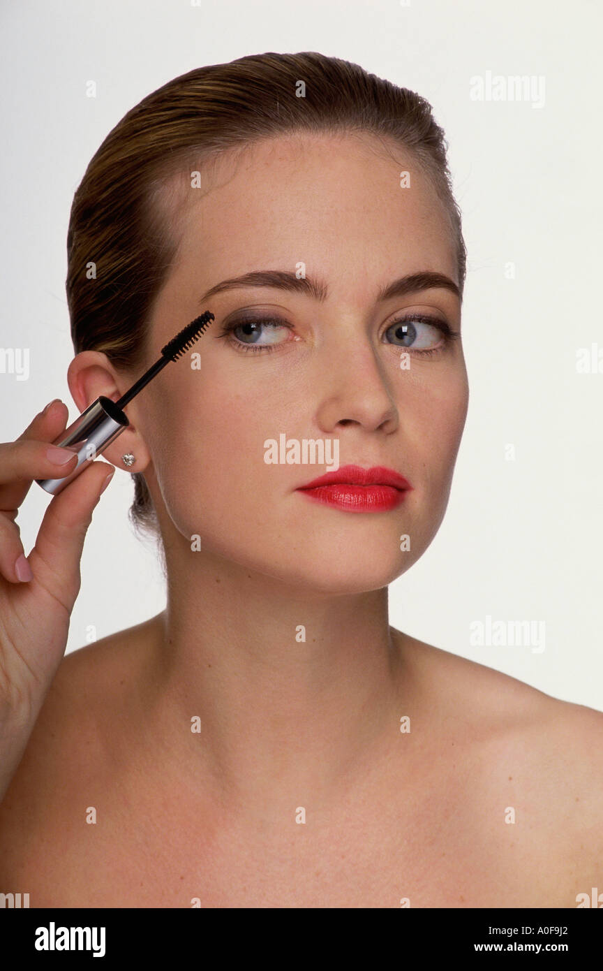 Close-up of a woman applying mascara Stock Photo