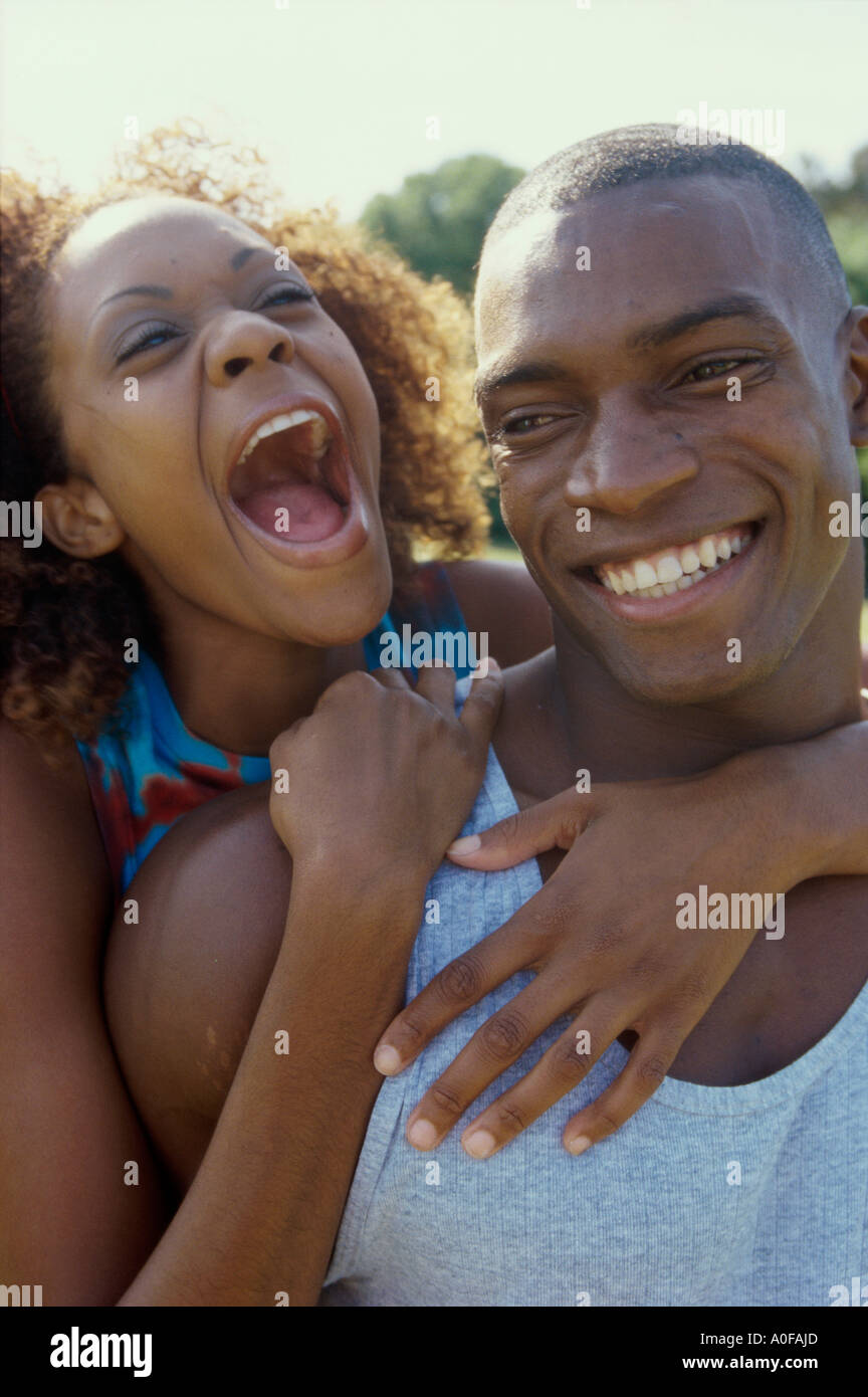 Woman arms around man looking at him hi-res stock photography and ...
