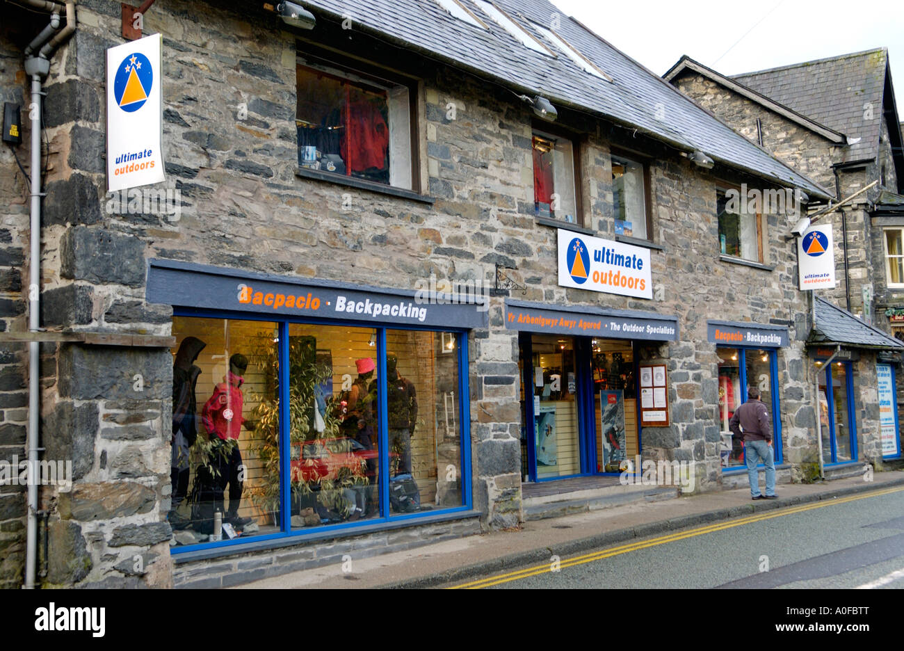 Outdoor clothing shops in Snowdonia grey stone village of Betws y Coed Gwynedd North Wales UK