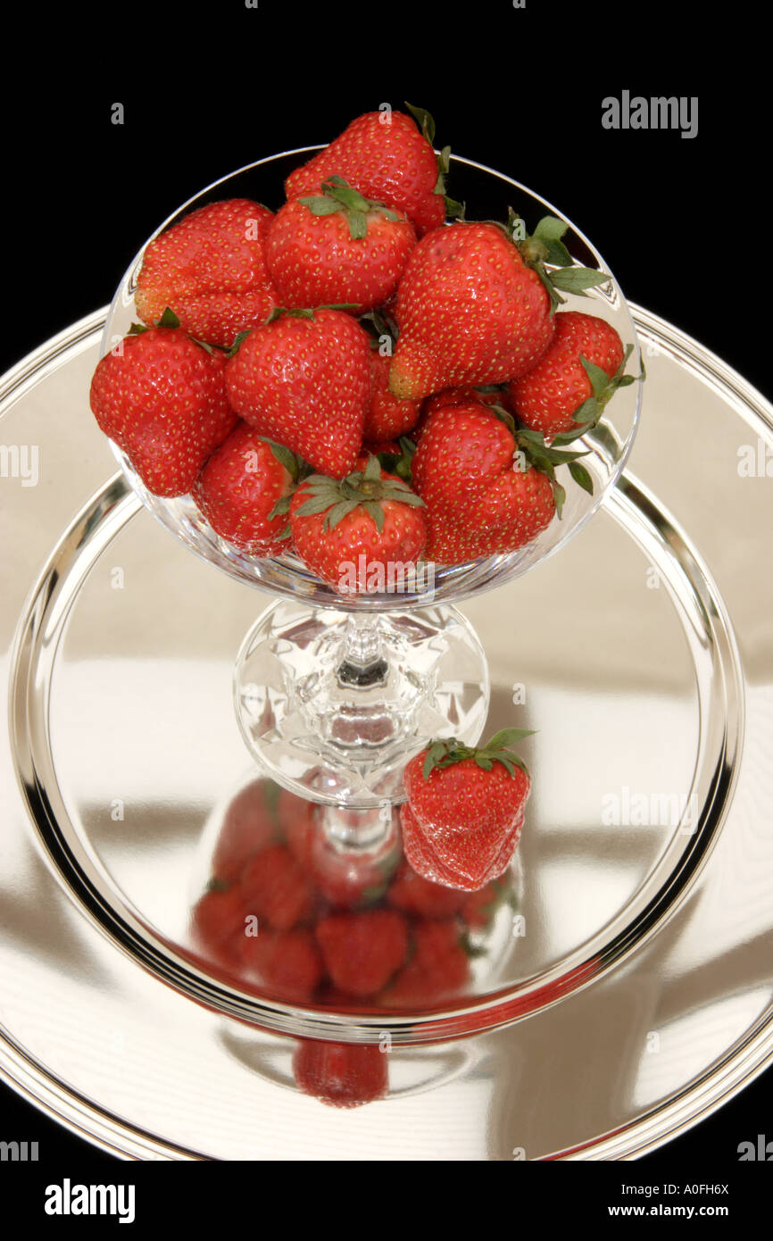 Strawberries in a glass on a silver tray Stock Photo - Alamy