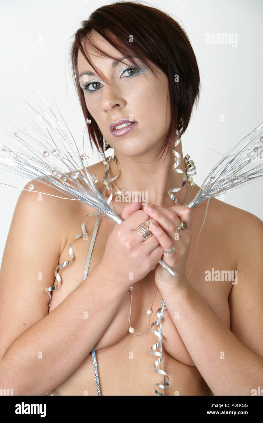 Portrait of a Woman Holding Silver Christmas Decorations Stock Photo