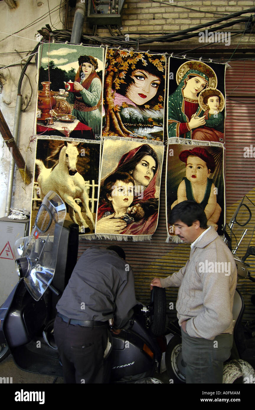Small carpets representing beautiful women for sale in the Tehran bazaar, Iran Stock Photo