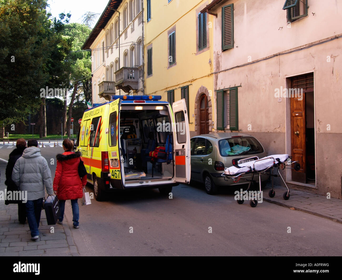 Ambulance blocking street responding to a call in Lucca Tuscany Italy Stock Photo