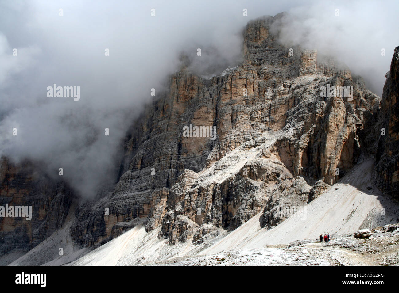 Walkers descend the valley near Lagazuoi in the Italian Dolomites Stock Photo