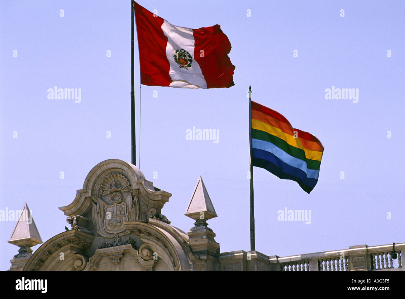 Peruvian and Incan Flags flying over the Peruvian presidential palace in Lima Stock Photo