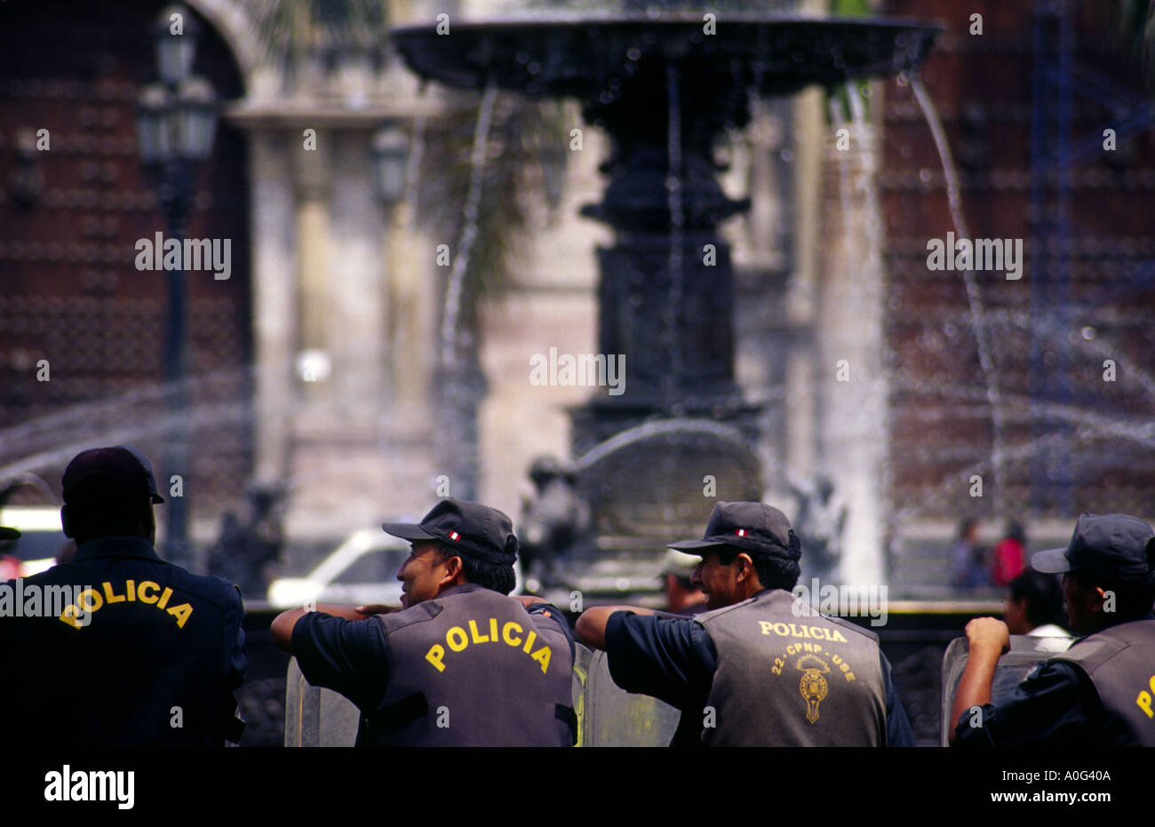 A line of riot policemen relax in Lima plaza de armas Stock Photo
