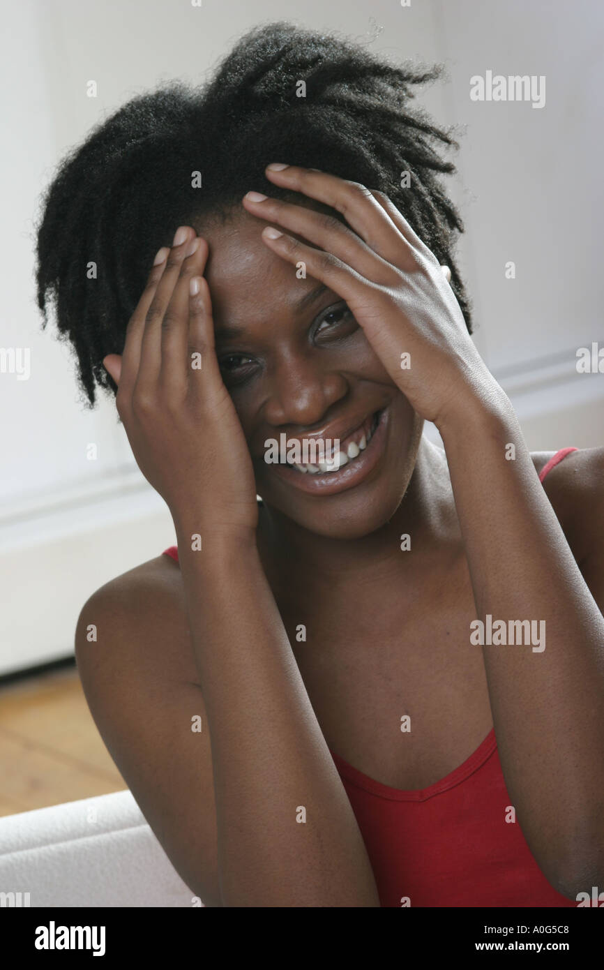 Black woman smiling at the camera Stock Photo - Alamy