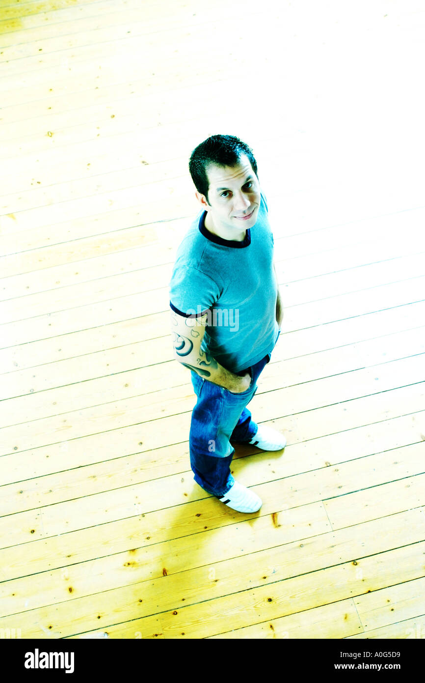 Man standing and looking up at the camera Stock Photo