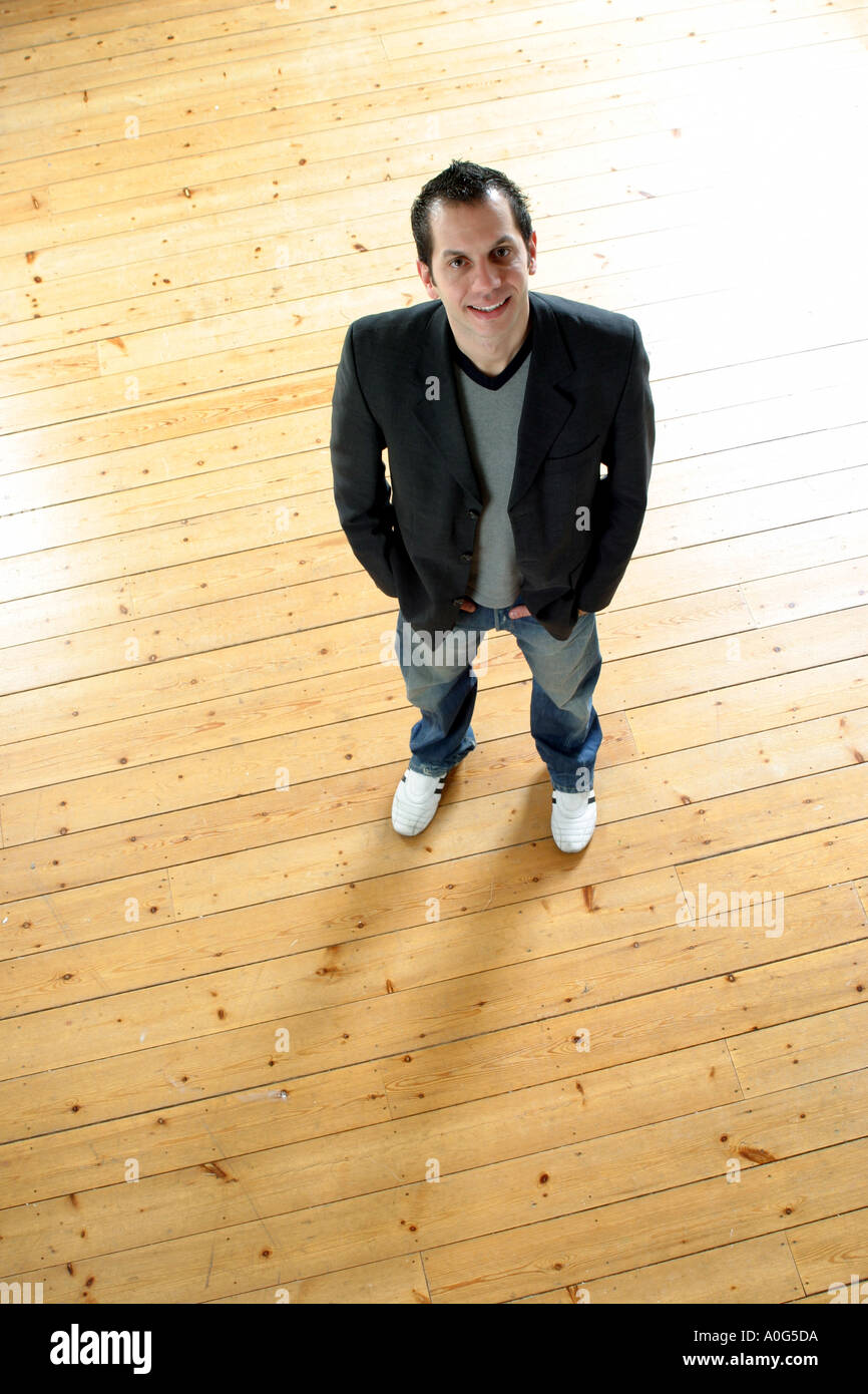 Man standing and looking up at the camera Stock Photo