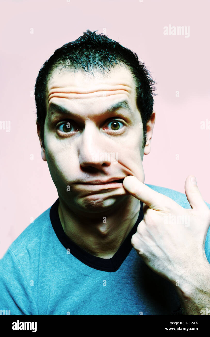 Young man pulling stupid face hires stock photography and images Alamy
