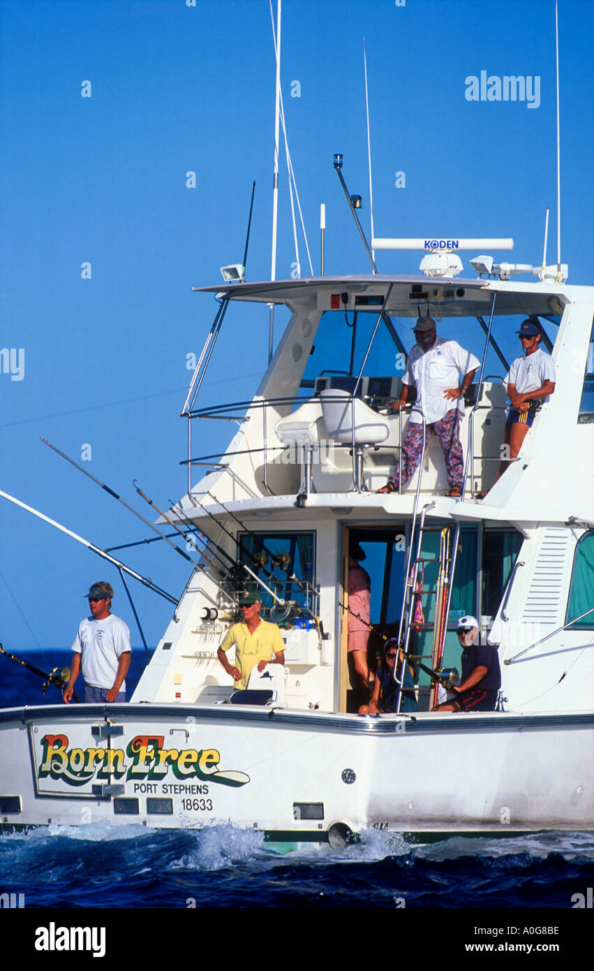 Big game fishing boat trolling near Great Barrier Reef off Cairns