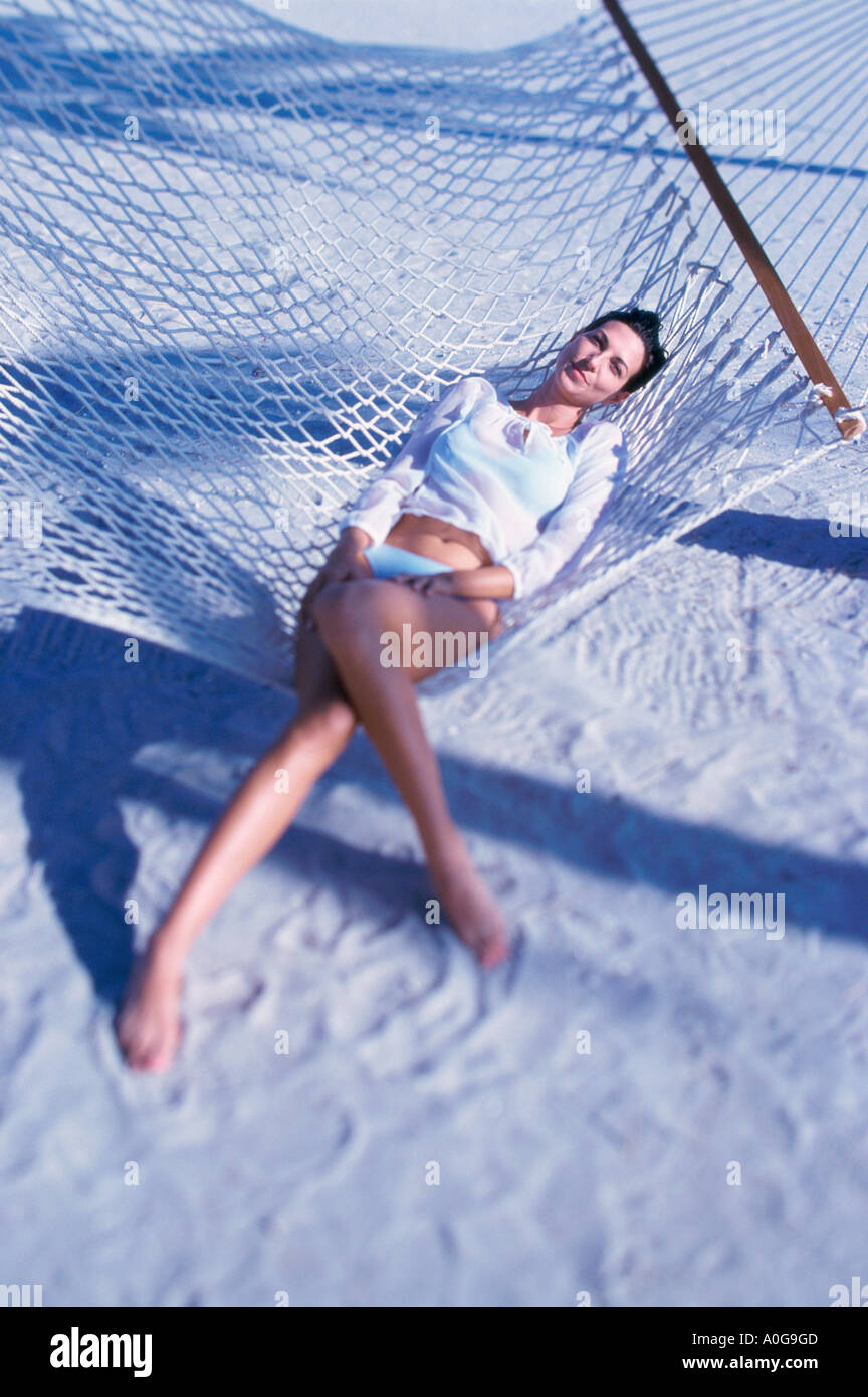 Young woman lying in a hammock Stock Photo - Alamy