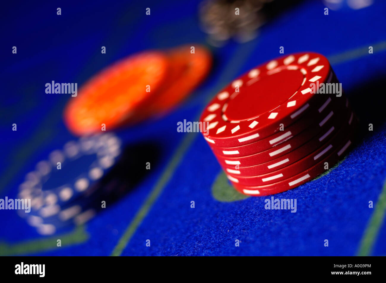 Chips on blue roulette table Stock Photo