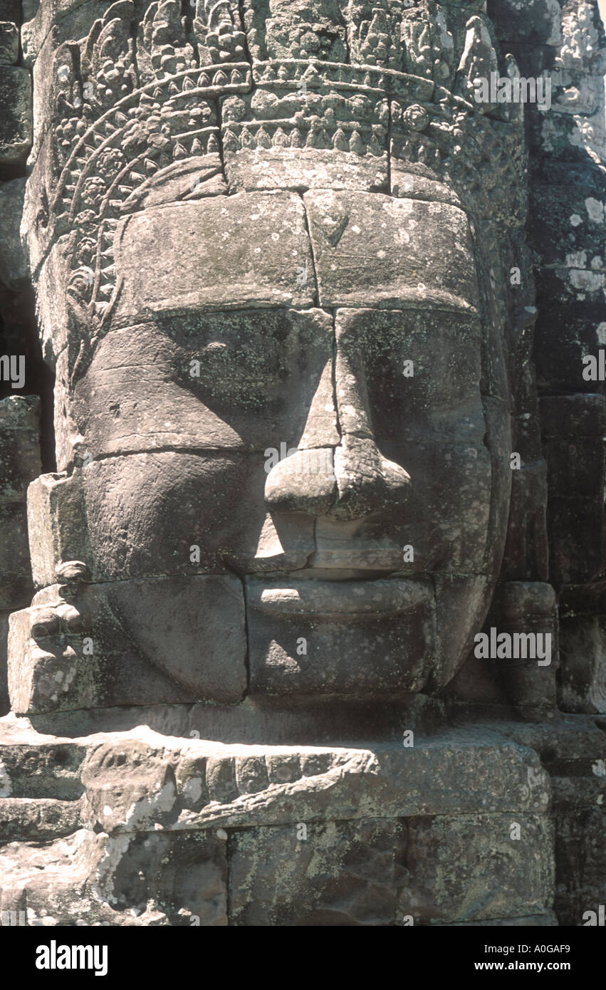 Sculptured head with enigmatic smile, Angkor Wat Stock Photo