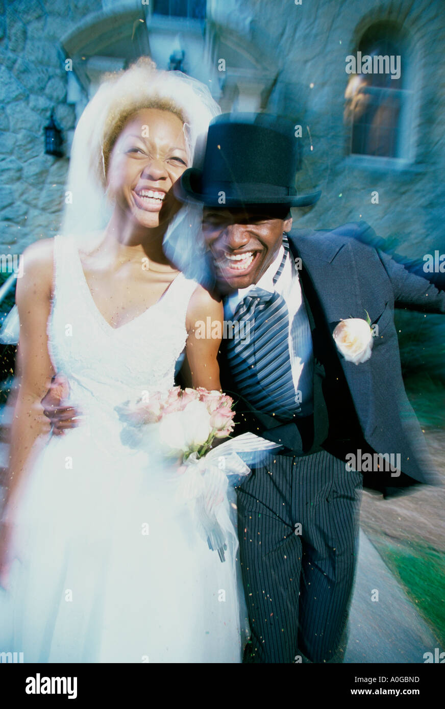 Newlywed couple running together Stock Photo