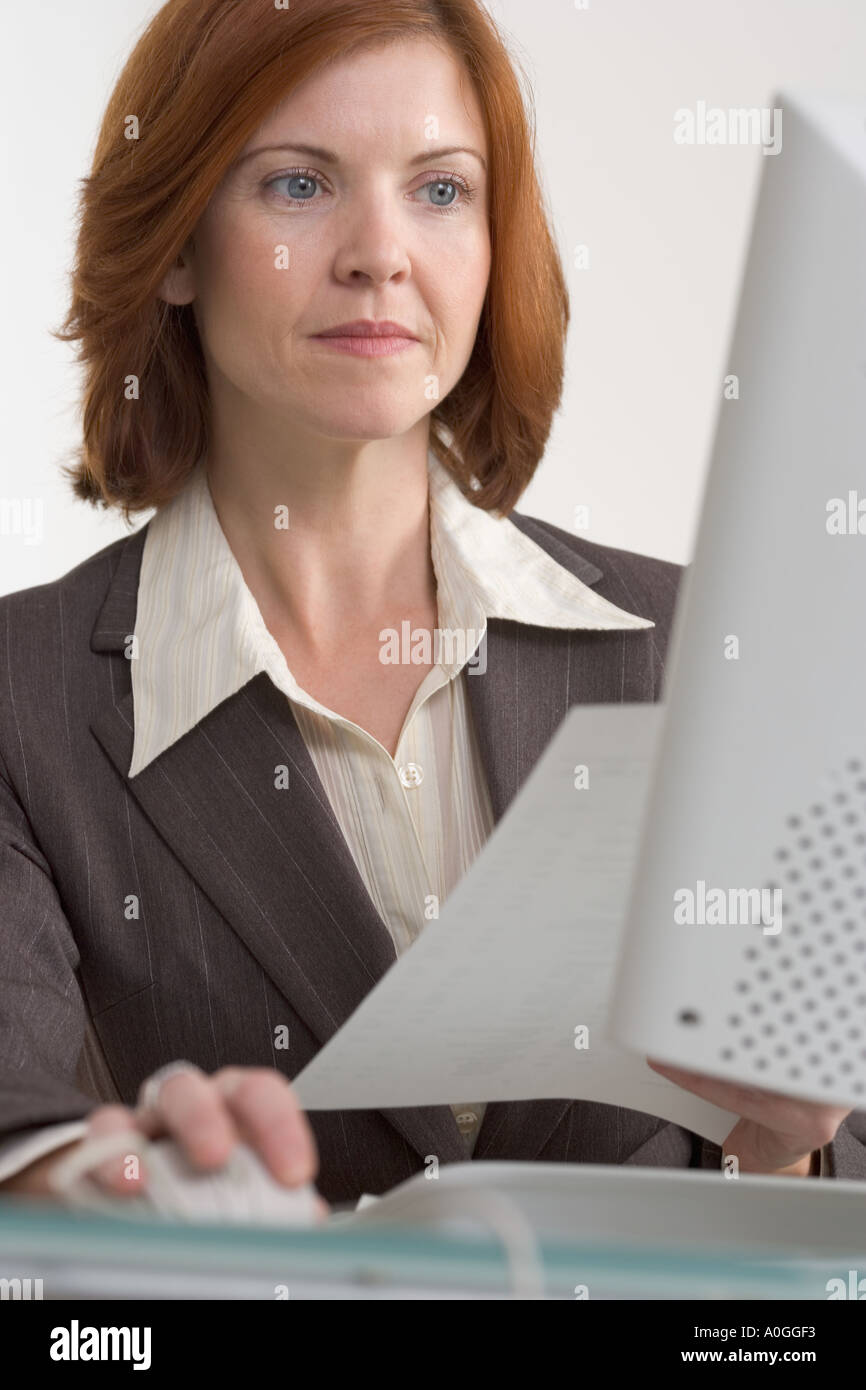 Businesswoman working on computer Stock Photo