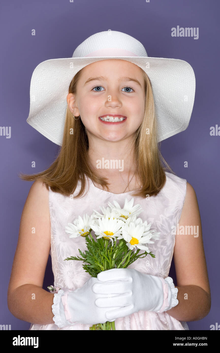 Girl holding a bunch of flowers Stock Photo - Alamy