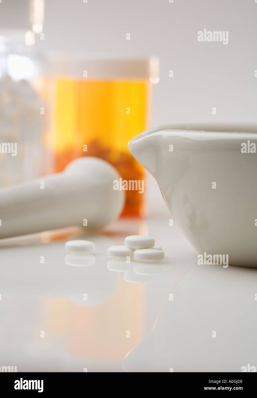 Pill bottles with mortar and pestle Stock Photo Alamy