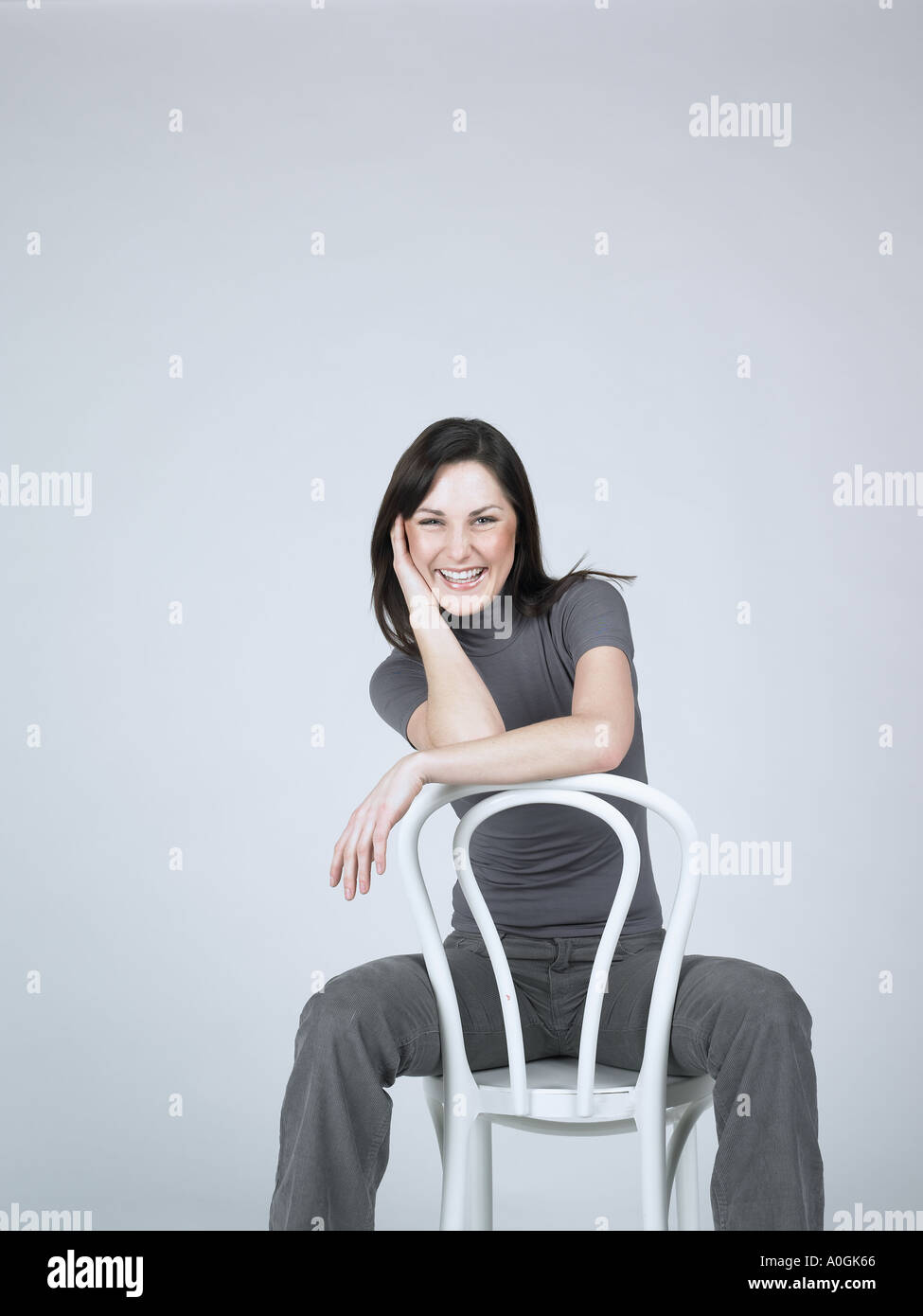 Female sitting on a chair hi-res stock photography and images - Alamy