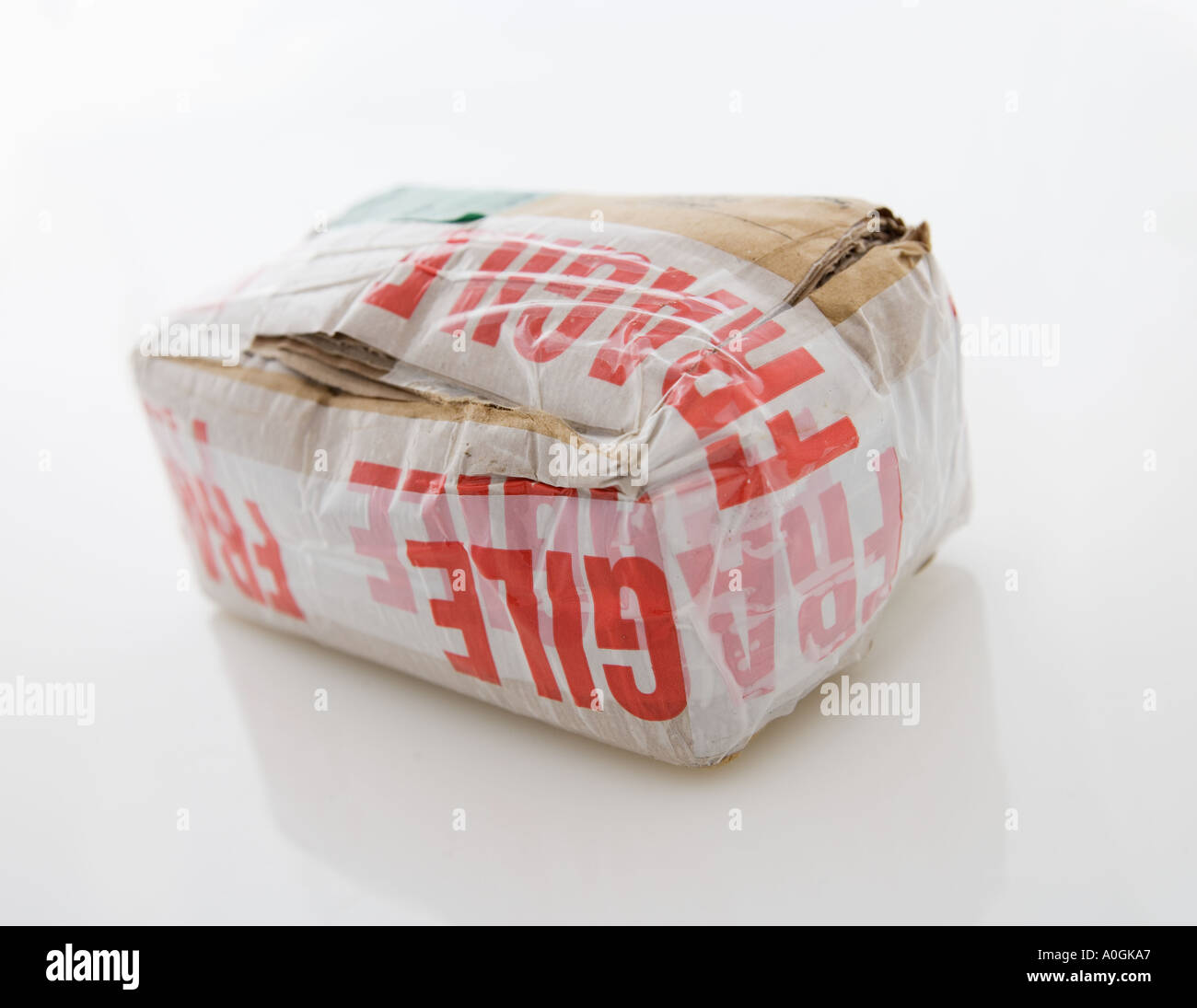 Bulky package with fragile tape Stock Photo