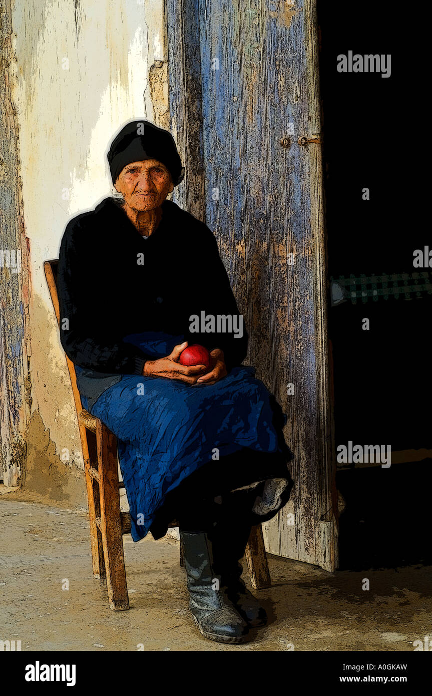 Old woman head scarf sitting hi-res stock photography and images - Alamy