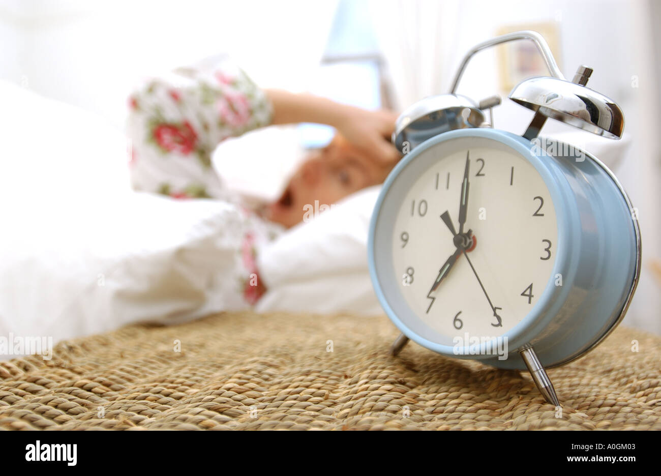 woman awake to alarm clock Stock Photo Alamy