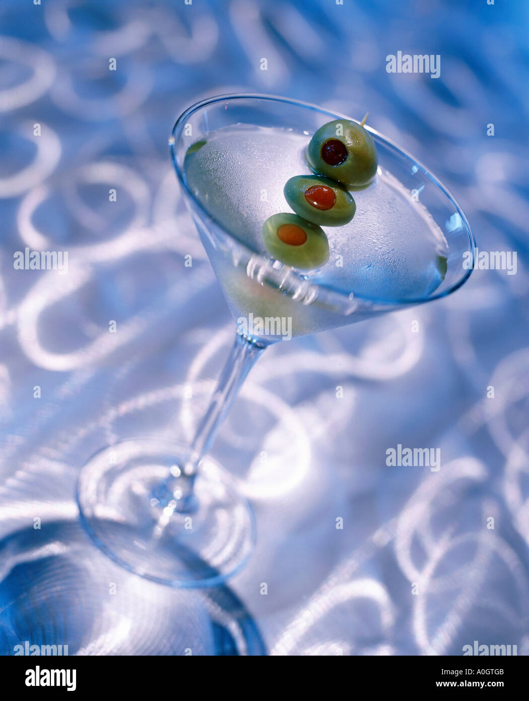 Green olives in a martini glass Stock Photo Alamy