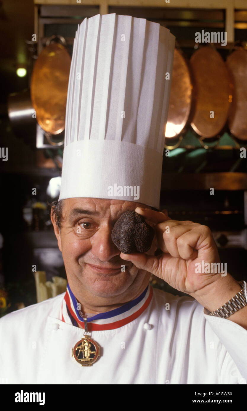 Paul Bocuse portrait with huge truffle in his restaurant Lyon France 1980s HOMER SYKES Stock Photo