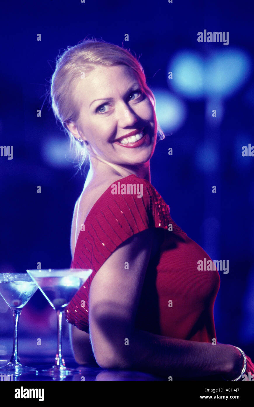 Leaning on bar hi-res stock photography and images - Alamy