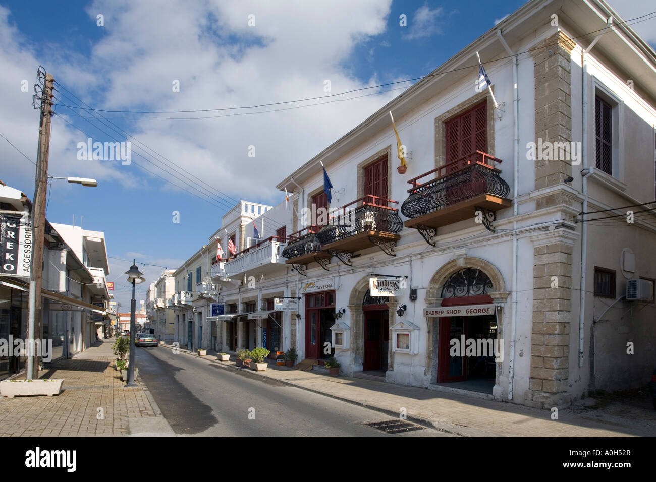 A STREET SCENE SHOWING THE KINIRAS HOTEL IN THE UPPER OLDER TOWN OF PAPHOS, CYPRUS Stock Photo