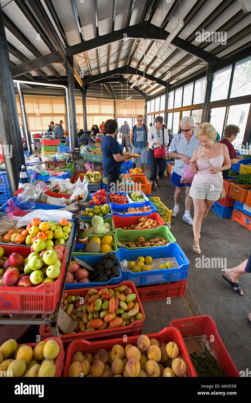 VISITORS WANDER AROUND THE OLD MARKET IN PAPHOS, CYPRUS Stock Photo