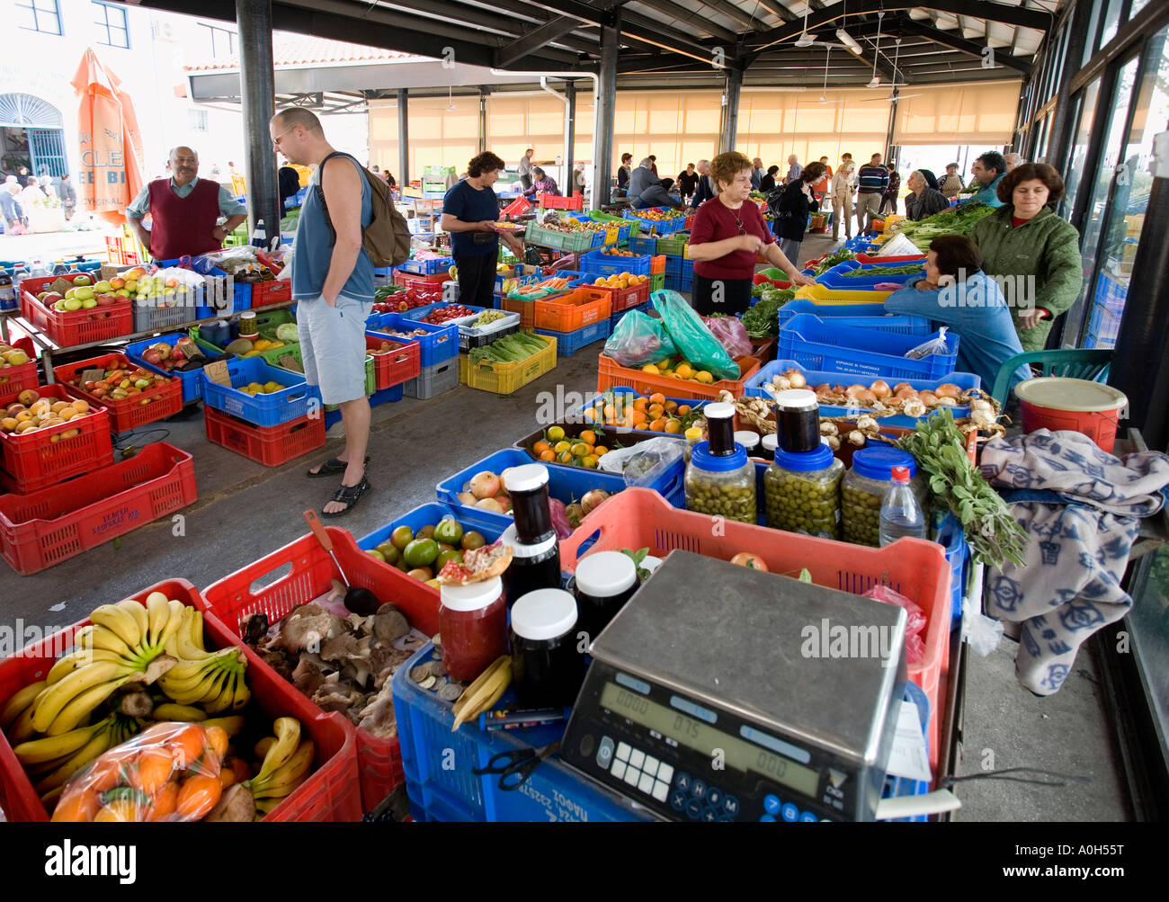 SHOPPERS WANDER AROUND THE PRODUCE MARKET AT PAPHOS, CYPRUS Stock Photo