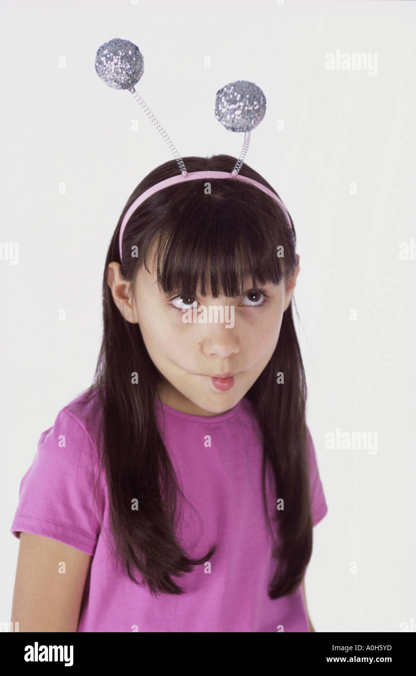 Girl wearing antenna making a face Stock Photo Alamy