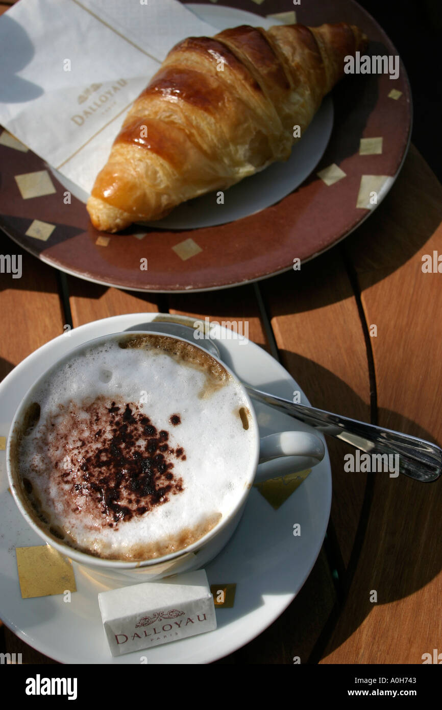 Cappucino and a croissant at Dalloyau high class tea room at Luxembourg Paris France Stock Photo