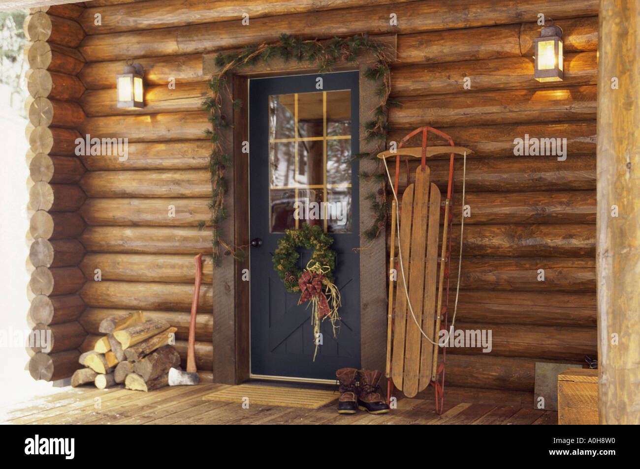 Christmas Decorations Around A Log Cabin Door Stock Photo 5712783