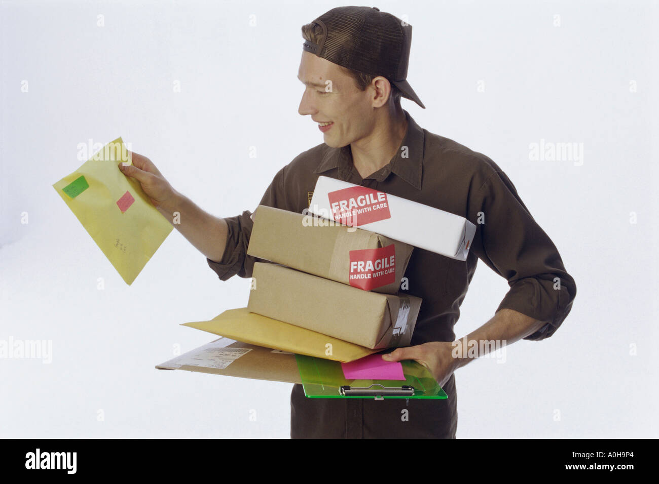 Delivery man holding delivery packages Stock Photo