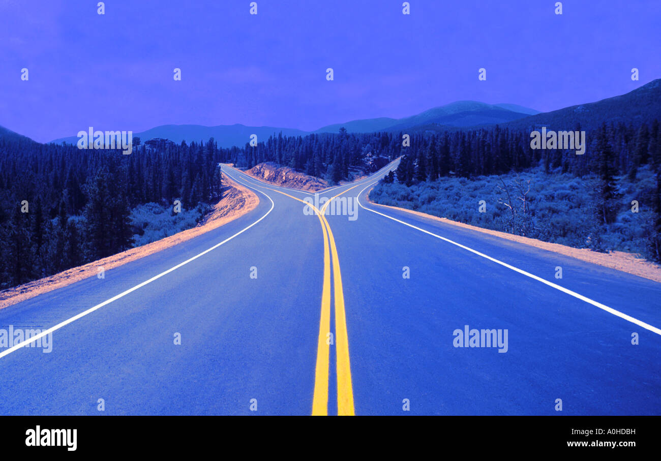 Fork in the road. Middle of the road. Decisions and making choices open spaces opportunities. Winding highway never-ending. Choice yours. right or left Stock Photo