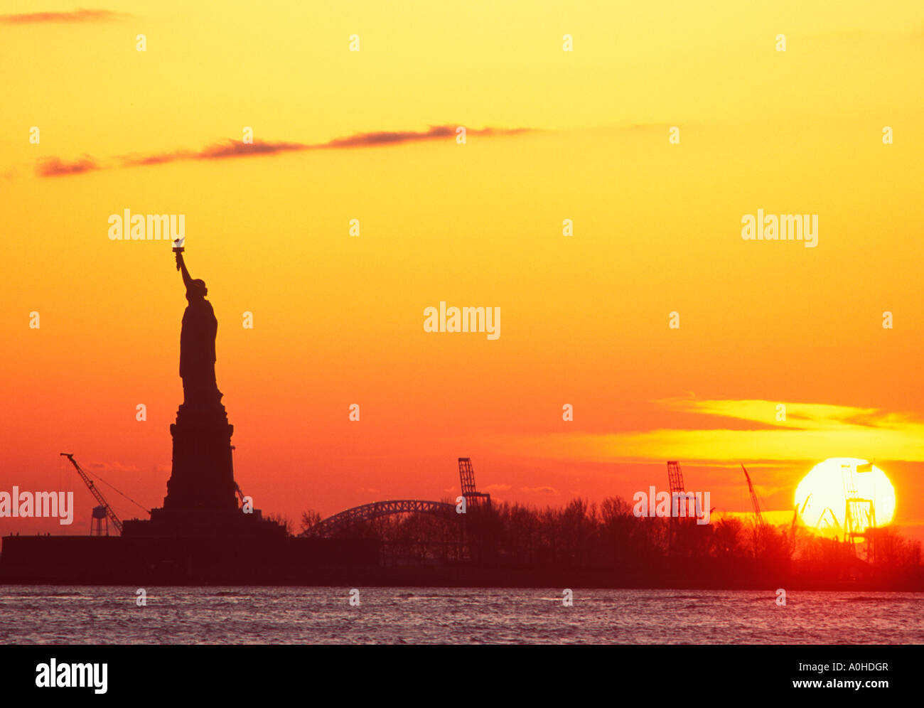 New York City Lower Manhattan The Statue of Liberty silhouetted full ...
