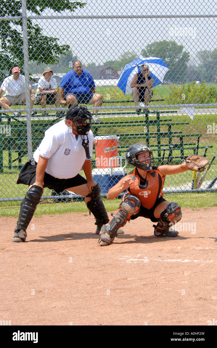 The Umpire and Catcher at a girls Major league Softball game Stock