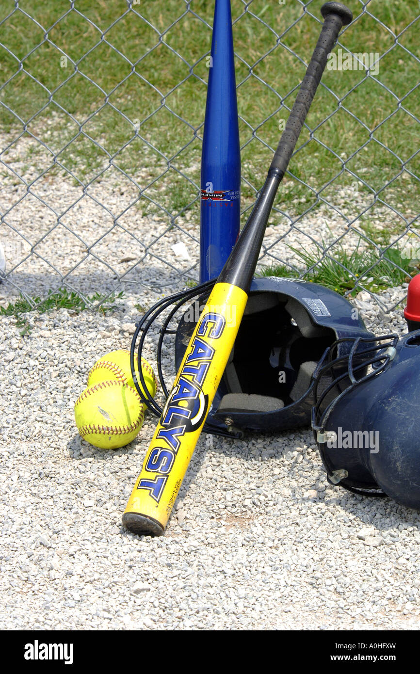 Softball helmet, bats and balls Stock Photo Alamy