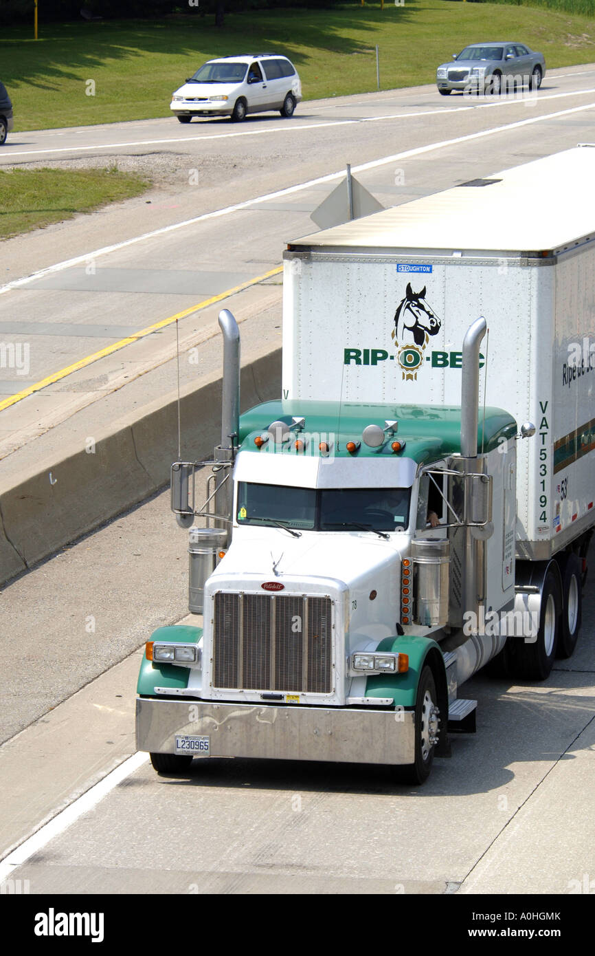 A Semi Truck on a Canadian Highway going to Michigan in the USA Stock