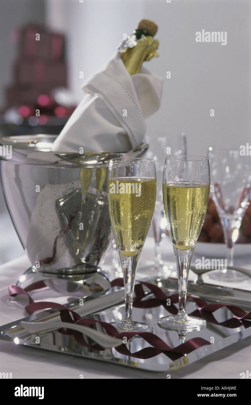 Champagne in a bucket with glasses Stock Photo Alamy