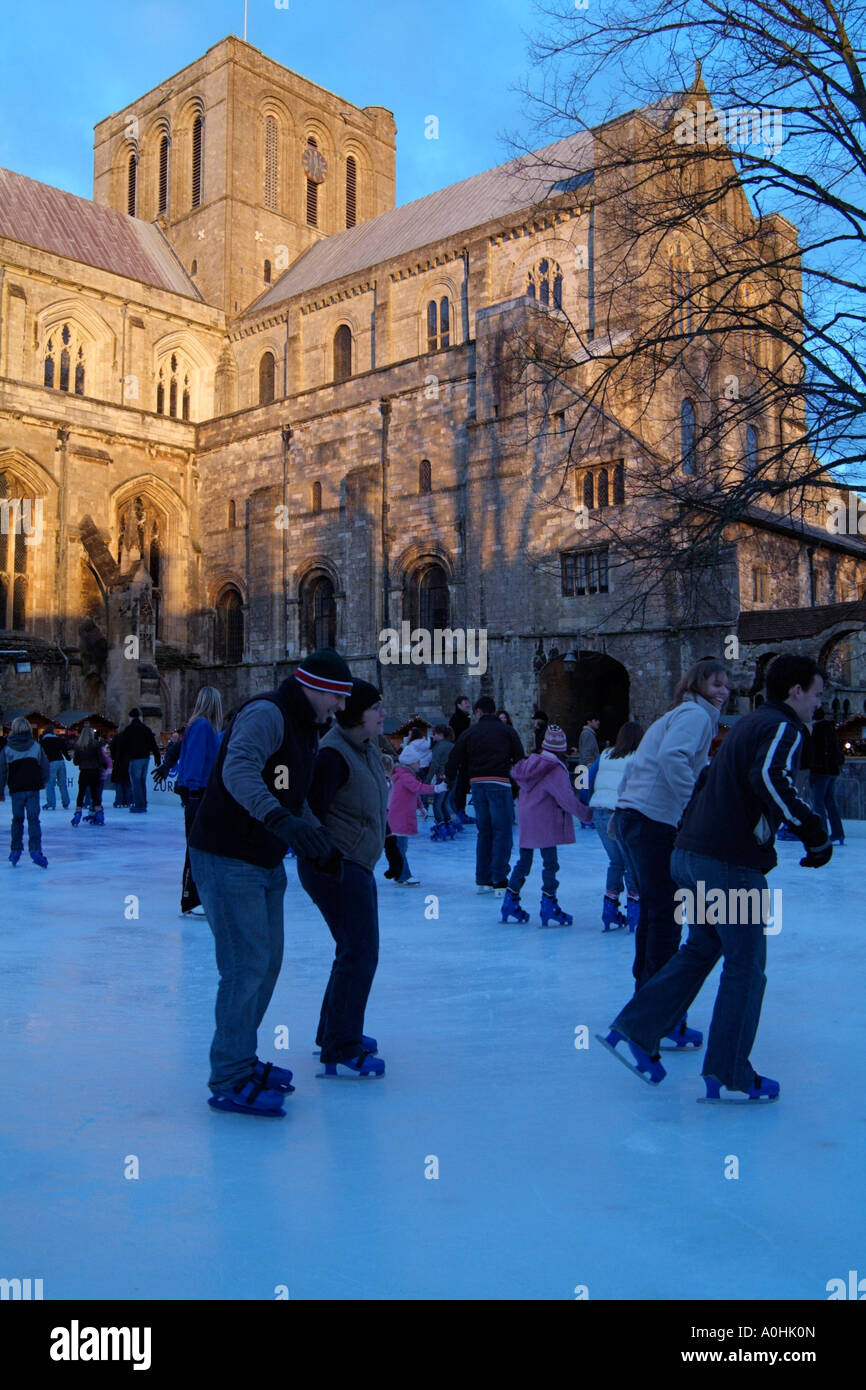 Winchester Cathedral ice rink a fund raising venture in the grounds of this historic church Stock Photo
